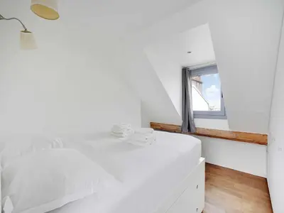 Un ou plusieurs lits dans un hébergement de l'établissement Appartement Moderne - 1BR- 4P- Montmartre