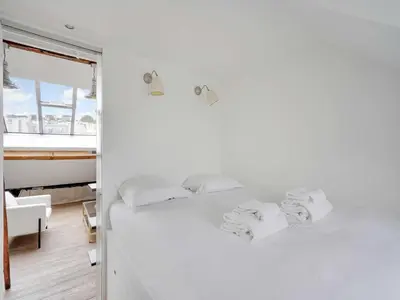 Un ou plusieurs lits dans un hébergement de l'établissement Appartement Moderne - 1BR- 4P- Montmartre