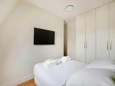 Un ou plusieurs lits dans un hébergement de l'établissement Bright apartment - 2BDR- 4P- Jardin du Luxembourg