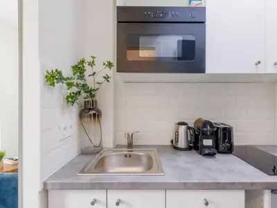 Cuisine ou kitchenette dans l'établissement Charming studio for 2 people - Mobility lease