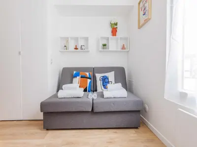 Coin salon dans l'établissement Studio Charmant 16ème Ar - bail mobilité