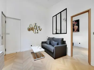 Coin salon dans l'établissement Elegant flat near Champs-Élysées