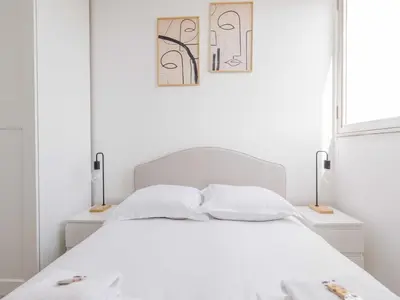 Un ou plusieurs lits dans un hébergement de l'établissement Apartment near 1 BDR 4P La Villette