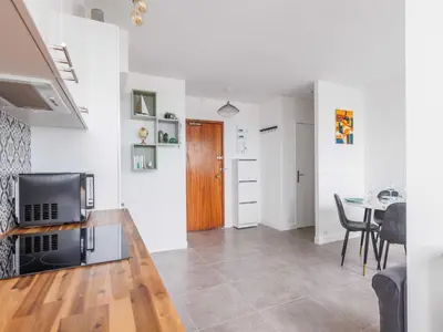 Coin salon dans l'établissement Apartment near 1 BDR 4P La Villette