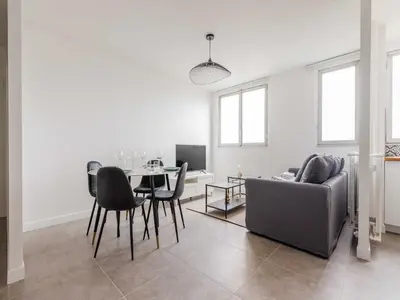Coin salon dans l'établissement Apartment near 1 BDR 4P La Villette