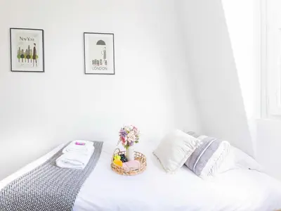 Un ou plusieurs lits dans un hébergement de l'établissement Charming studio 1P near Av Montaigne