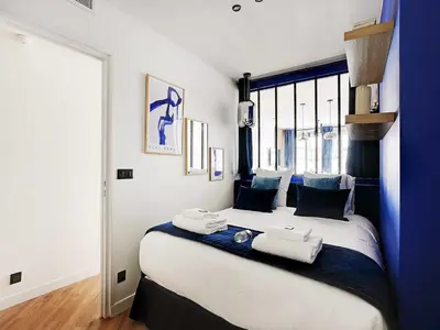 Un ou plusieurs lits dans un hébergement de l'établissement Magnifique appartement -1BR 4P - Arc de Triomphe