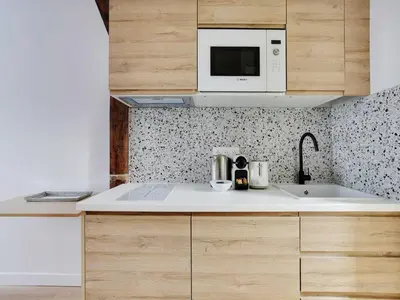 Cuisine ou kitchenette dans l'établissement Beautiful studio -16 ard de paris- Mobility lease