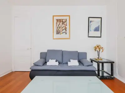 Coin salon dans l'établissement Comfortable flat - 1BD 4P - Gare Est