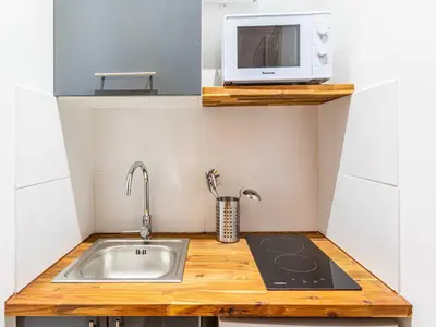 Cuisine ou kitchenette dans l'établissement Cosy Studio 2P Quai de Jemmapes