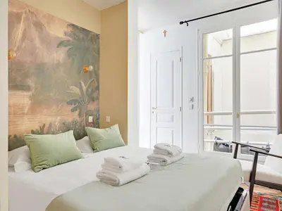 Un ou plusieurs lits dans un hébergement de l'établissement Peaceful Apt - 1BD 4P - Palais Royal Louvre
