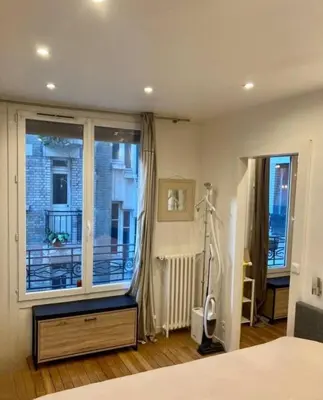Un ou plusieurs lits dans un hébergement de l'établissement Appartement Paris 15