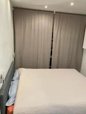 Un ou plusieurs lits dans un hébergement de l'établissement Appartement Paris 15