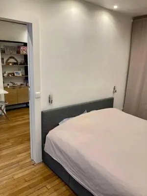 Un ou plusieurs lits dans un hébergement de l'établissement Appartement Paris 15