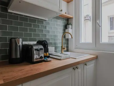 Cuisine ou kitchenette dans l'établissement Cozy 1BDR Apt 4P Getaway in Central Paris