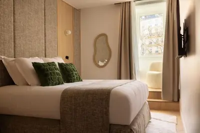 Un ou plusieurs lits dans un hébergement de l'établissement Cosy apat with AC -3BR- 8P- Canal Saint-Martin