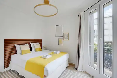 Un ou plusieurs lits dans un hébergement de l'établissement Modern apartment - 2BDR 6P - Paris 14e