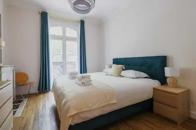 Un ou plusieurs lits dans un hébergement de l'établissement Beautiful Apt - 2BD 6P - Beaugrenelle