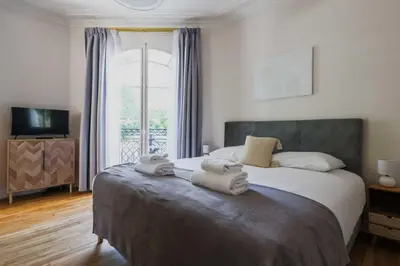 Un ou plusieurs lits dans un hébergement de l'établissement Beautiful Apt - 2BD 6P - Beaugrenelle