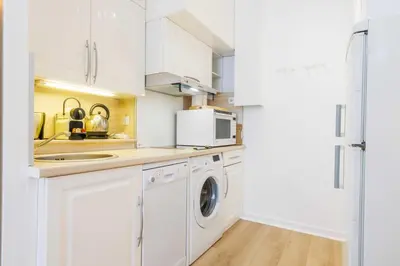 Cuisine ou kitchenette dans l'établissement Charming studio 2P in the heart of Paris