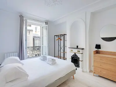 Un ou plusieurs lits dans un hébergement de l'établissement Superb apartment for 4 pers - Arc de Triomphe-Bail Mobility