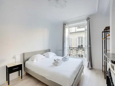 Un ou plusieurs lits dans un hébergement de l'établissement Superb apartment for 4 pers - Arc de Triomphe-Bail Mobility