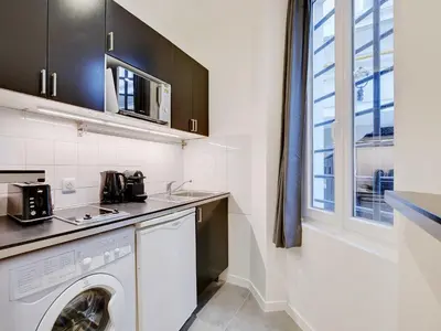 Cuisine ou kitchenette dans l'établissement Charming 2P studio - Bastille Charonne
