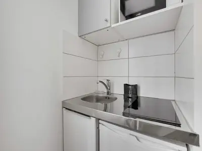 Cuisine ou kitchenette dans l'établissement Intimate Studio-2P- Sacre Coeur Abesse