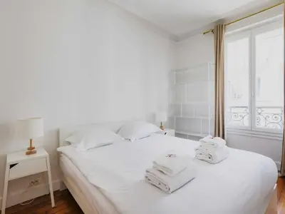 Un ou plusieurs lits dans un hébergement de l'établissement Elegant flat - 1BR 4P - Jardin du Luxembourg