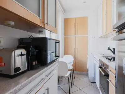 Cuisine ou kitchenette dans l'établissement Elegant flat - 1BR 4P - Jardin du Luxembourg