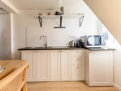 Cuisine ou kitchenette dans l'établissement Studio COSY in the heart of Paris - Mobility lease