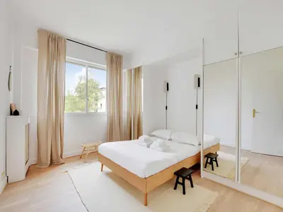 Un ou plusieurs lits dans un hébergement de l'établissement Comfortable and modern apt - 2BD 6P - Neuilly