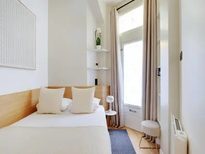 Un ou plusieurs lits dans un hébergement de l'établissement Charming Apt - 1BD 4P - Invalides Bon Marché