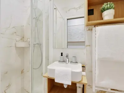 Salle de bains dans l'établissement Charming Apt - 1BD 4P - Invalides Bon Marché
