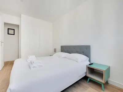 Un ou plusieurs lits dans un hébergement de l'établissement Bright flat - 1BR 4P - Javel