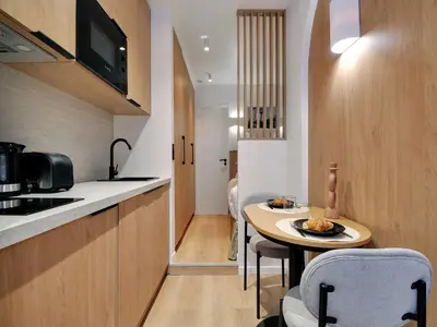 Cuisine ou kitchenette dans l'établissement Charming studio - 16th district - Mobility lease