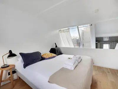 Un ou plusieurs lits dans un hébergement de l'établissement Cosy and atypical Marais Balcony - 1 BDR 2 P