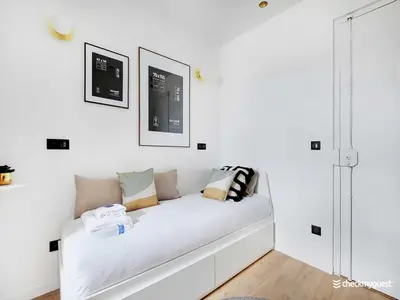 Un ou plusieurs lits dans un hébergement de l'établissement Air-conditioned studio near Arc Triomphe