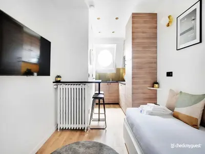 Un ou plusieurs lits dans un hébergement de l'établissement Air-conditioned studio near Arc Triomphe