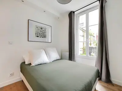 Un ou plusieurs lits dans un hébergement de l'établissement Modern apartment - 2BD 6P - Batignolles