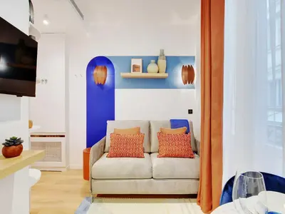Coin salon dans l'établissement Cozy Parisian 2P Studio in the Prestigious 8th