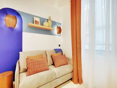 Coin salon dans l'établissement Cozy Parisian 2P Studio in the Prestigious 8th