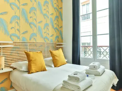 Un ou plusieurs lits dans un hébergement de l'établissement Magnificent Apartment - 2BR 4P - Grand boulevard