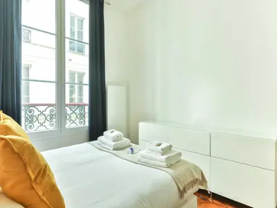 Un ou plusieurs lits dans un hébergement de l'établissement Magnificent Apartment - 2BR 4P - Grand boulevard