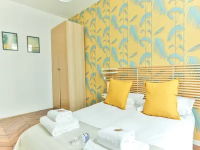 Un ou plusieurs lits dans un hébergement de l'établissement Magnificent Apartment - 2BR 4P - Grand boulevard