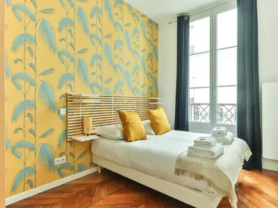 Un ou plusieurs lits dans un hébergement de l'établissement Magnificent Apartment - 2BR 4P - Grand boulevard