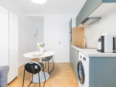 Cuisine ou kitchenette dans l'établissement Charming studio 1P Neuilly Seine - Porte Maillot