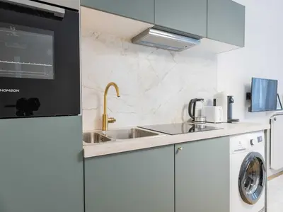 Cuisine ou kitchenette dans l'établissement Charming studio 1P Neuilly Seine - Porte Maillot