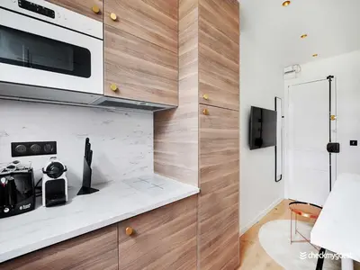 Cuisine ou kitchenette dans l'établissement A Cocoon just a stone's throw from the Arc de Triomphe