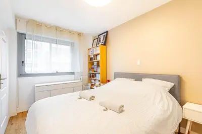 Un ou plusieurs lits dans un hébergement de l'établissement GuestReady - A lovely gem near Paris